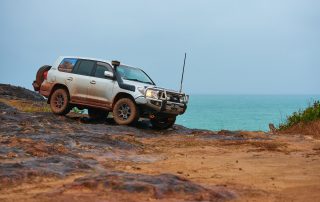 ROH 4WD Trophy wheel LC200 Cape York on rocks with ocean view