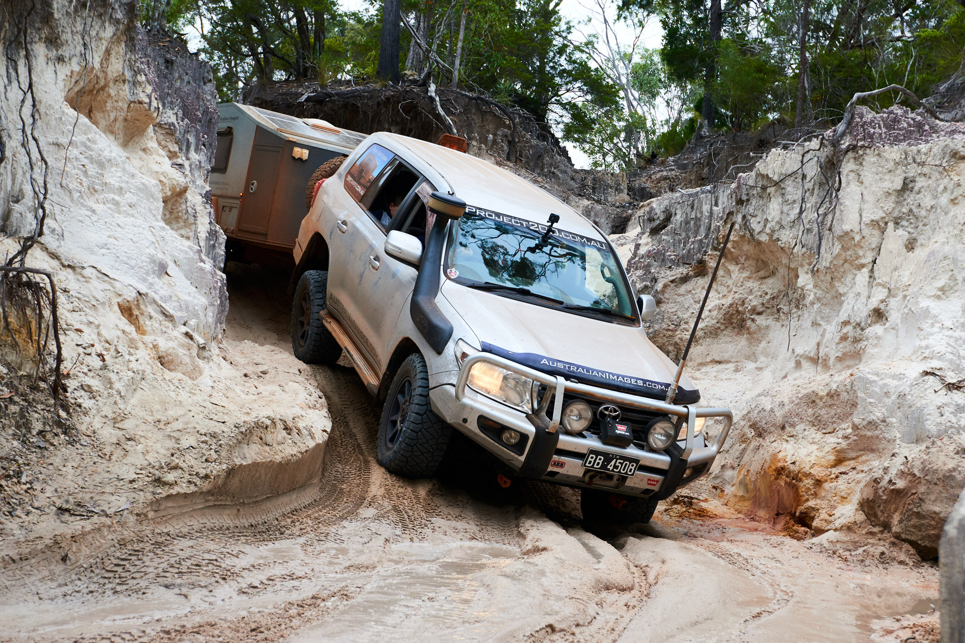 ROH 4x4 Trophy wheels on LC200 Cape York driving from rocks through sandy beach entry