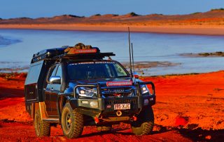 Sunraysia Steel 4WD Touring DMAX lake red dust background