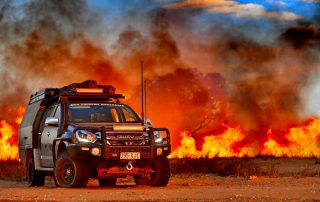 Steel wheels 4WD Touring DMAX bushfire background
