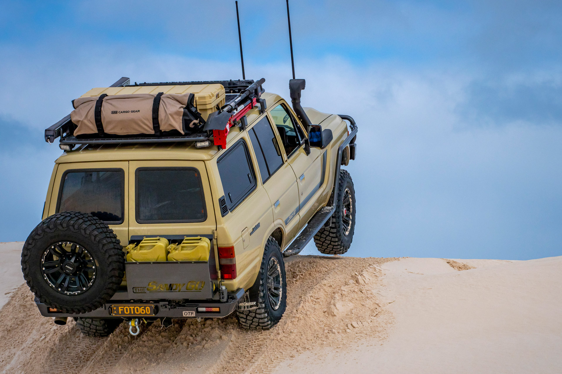 ROH Vapour wheels on Sandy 60 Series LandCruiser on the beach getting airborne