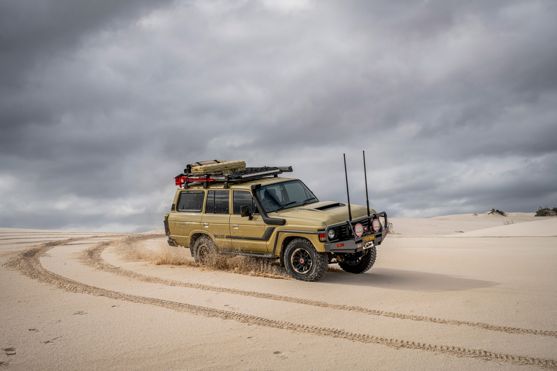 ROH Vapour wheels on Sandy 60 Series LandCruiser carving up the beach
